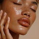 Beautiful womans face with hydrated skin. Find out your skin type in this blog. Unfurl