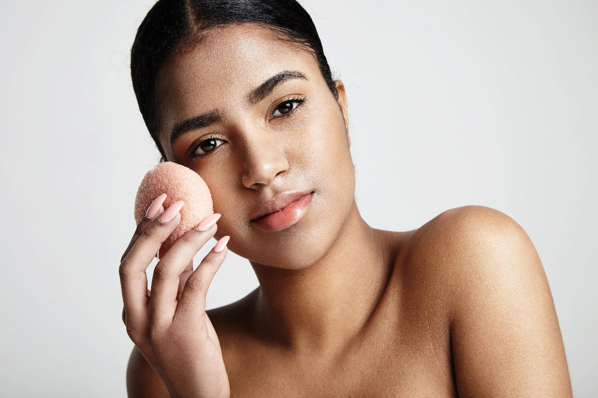 Women using a konjac sponge to wash her face
