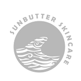 Sunbutter Skincare logo with a circular design featuring a wave and text.