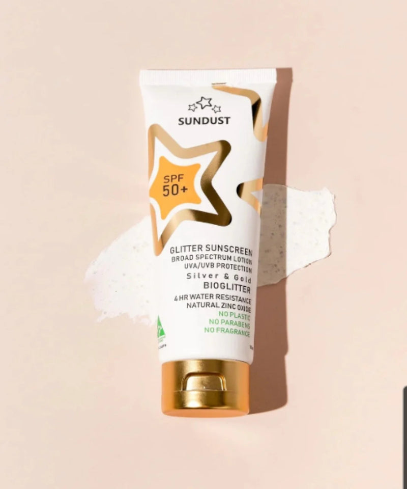 Sundust Sunscreen tube with glittery star design on a beige background