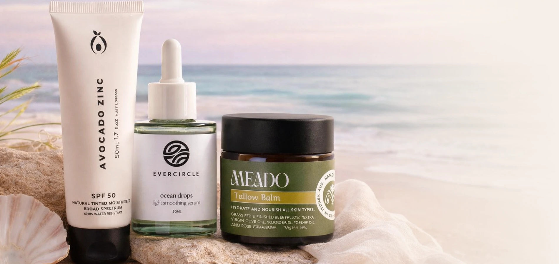 Australian made natural skincare products against an ocean background