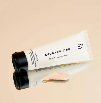 Avocado Zinc tinted moisturiser on a beige background