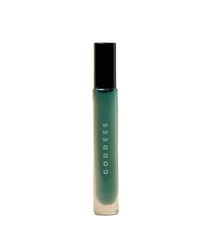 A glass roller of non-toxic perfume called Goddess against a white background